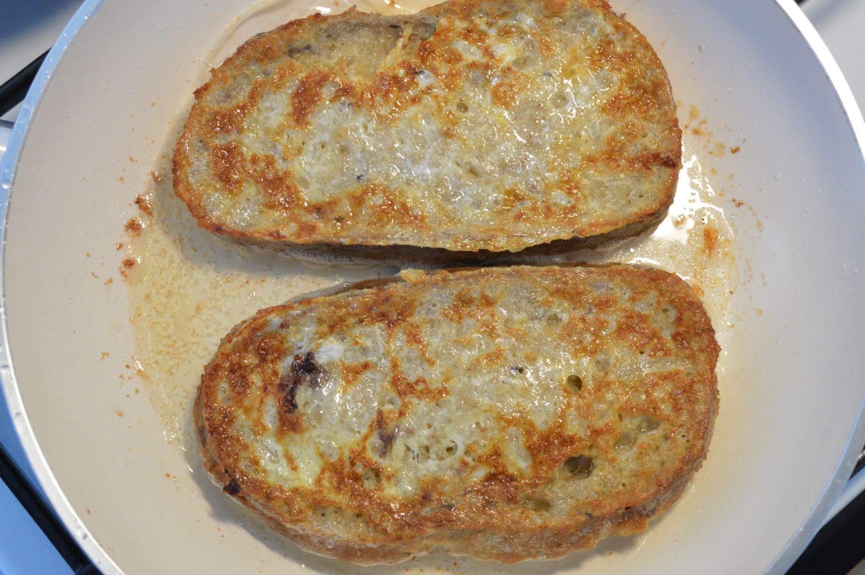 frying egg-coated bread