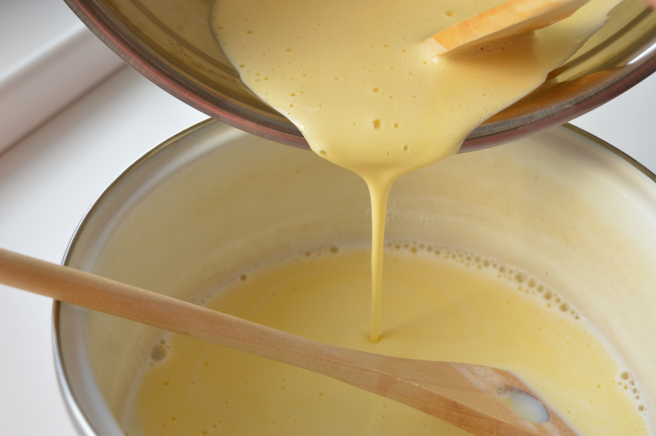 pouring egg mixture to the milk